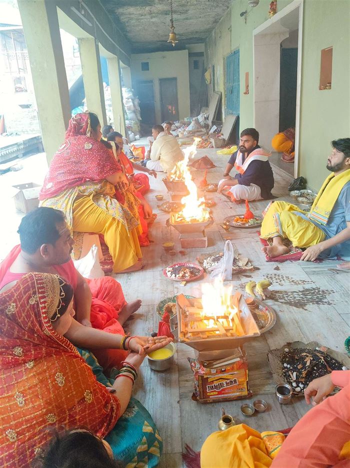 Devotees seated at havan ceremonies with our pandits
